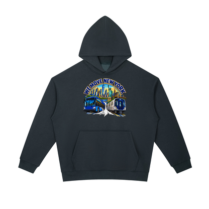 We Move New York Pullover Hoodie — navy heavyweight brushed fleece with the NY transit badge printed on left chest and full back, featuring the Manhattan skyline, Statue of Liberty, bus, and subway train.