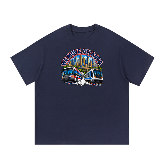 We Move Atlanta Tee — navy heavyweight cotton with the ATL transit badge featuring the Atlanta skyline, MARTA train, and bus, printed on the front.