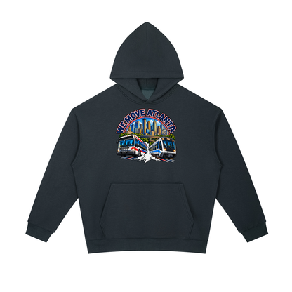 We Move Atlanta Pullover Hoodie — navy heavyweight brushed fleece with the ATL transit badge printed on left chest and full back, featuring the Atlanta skyline, MARTA train, and bus.