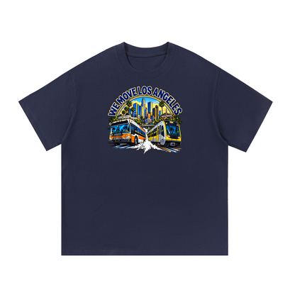 We Move Los Angeles Tee — navy heavyweight cotton with the LA transit badge featuring the LA skyline, Metro train, and bus, printed on the front.