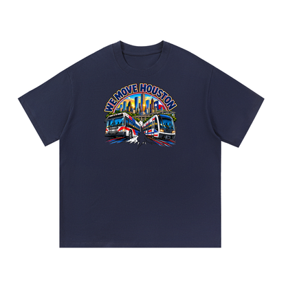 We Move Houston Tee — navy heavyweight cotton with the HOU transit badge featuring the Houston skyline, METRORail, and bus, printed on the front.